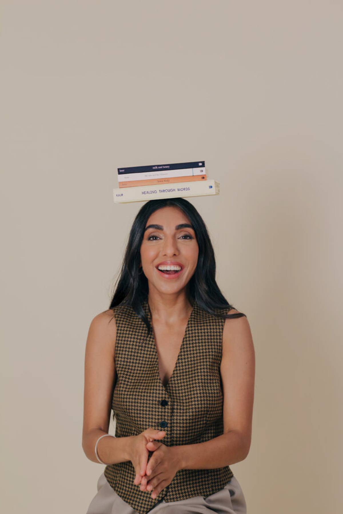 Rupi Kaur with her published books