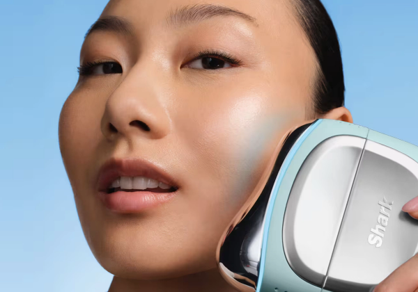 Woman using the new SharkNinja Depuffi cooling facial tool