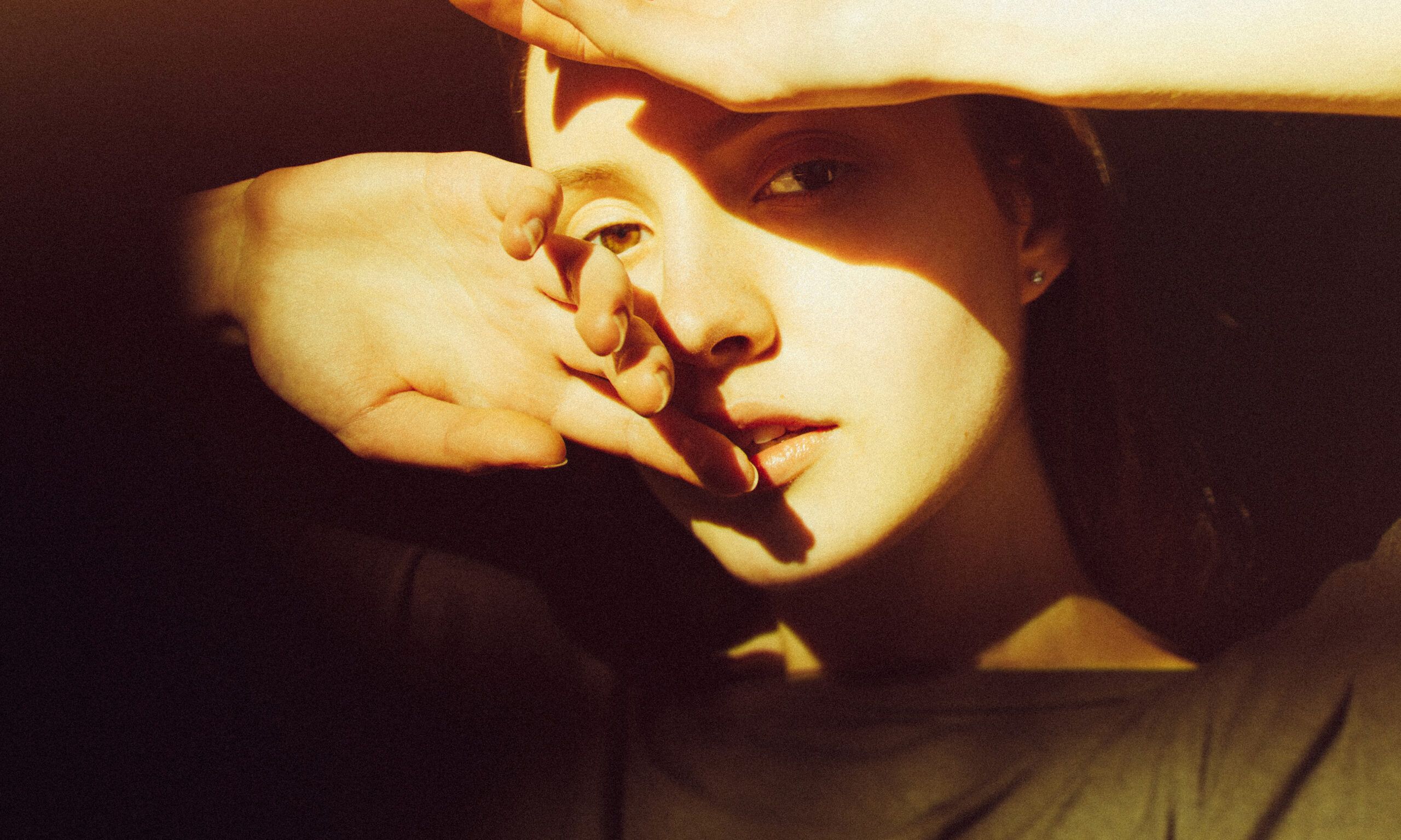 Close-up of young woman in sunlight