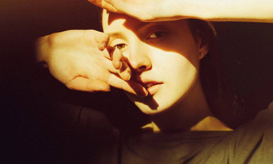 Close-up of young woman in sunlight