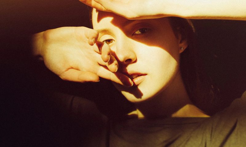 Close-up of young woman in sunlight