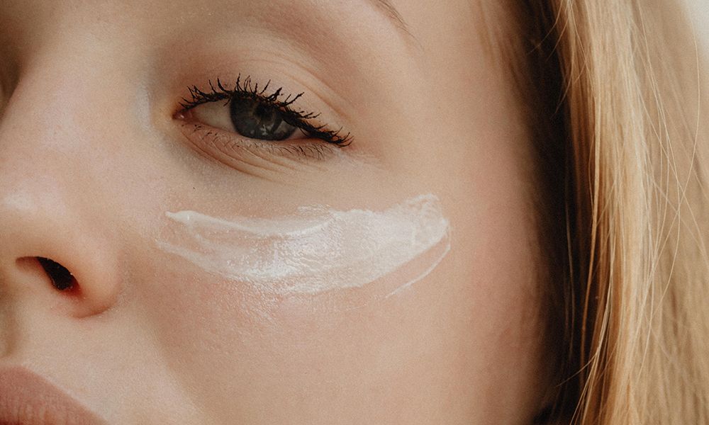 up close image of eye cream on woman's undereye