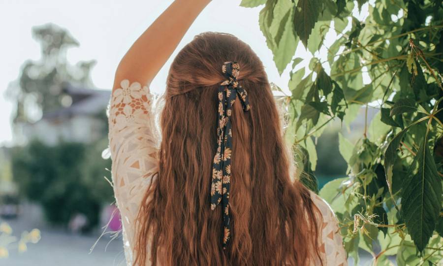 back of woman's hair wearing a hair bow