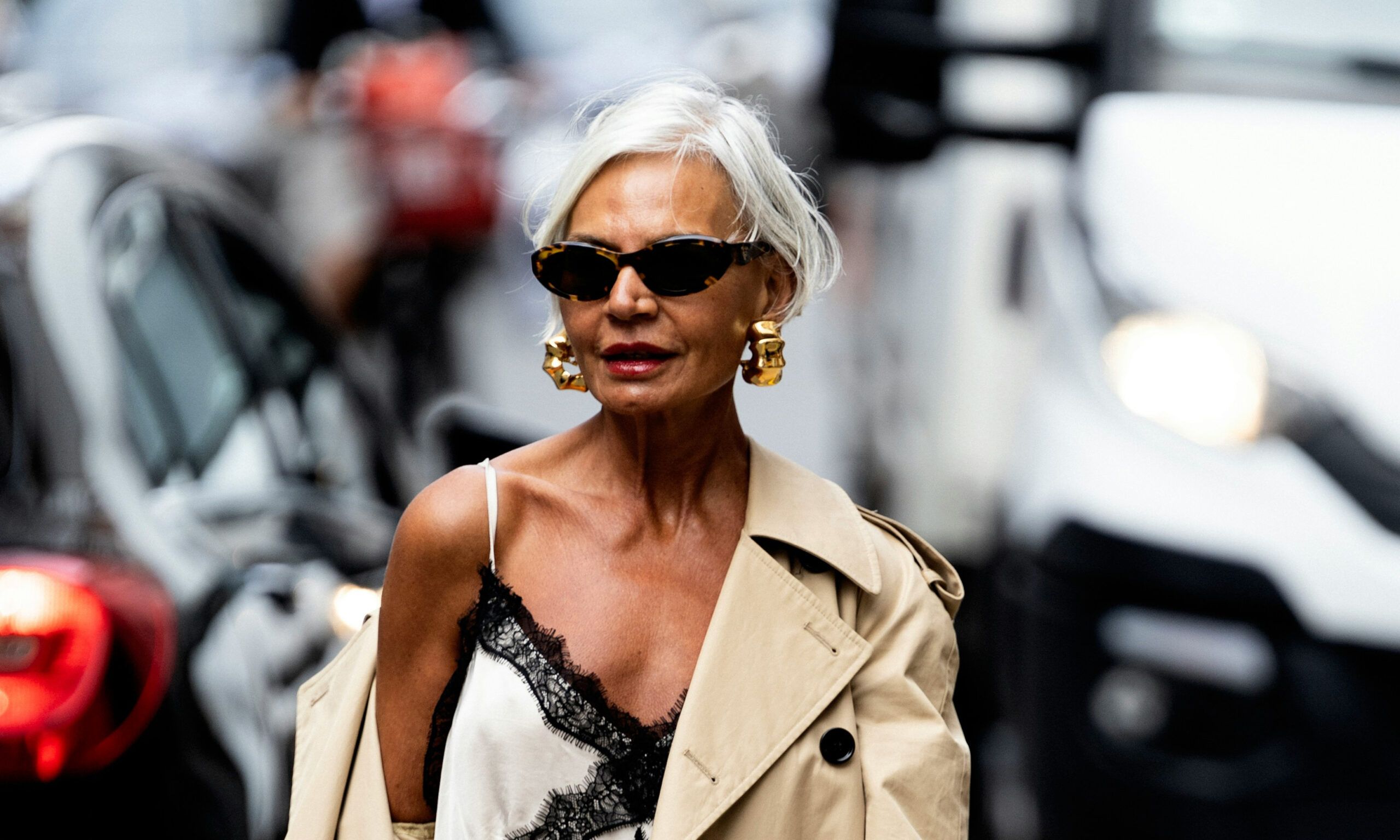 older woman standing in street