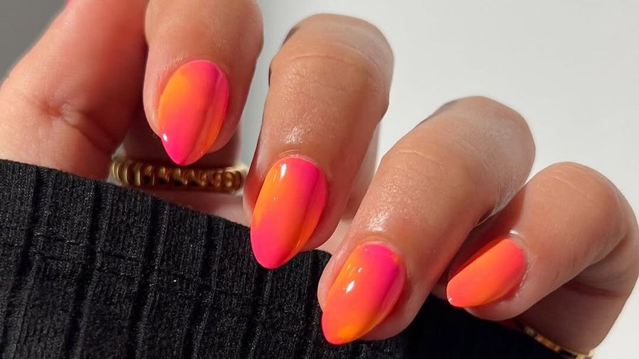 short nails with pink and orange polish