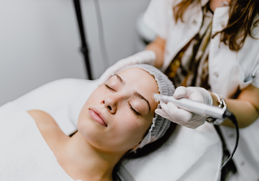 woman getting microneedling treatment on the face
