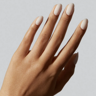 image of hand with porcelain-inspired, off-white nail polish