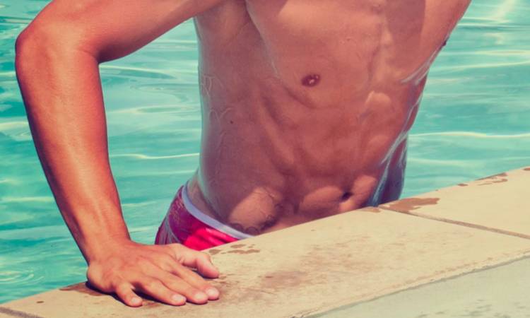 male abs coming out of a pool