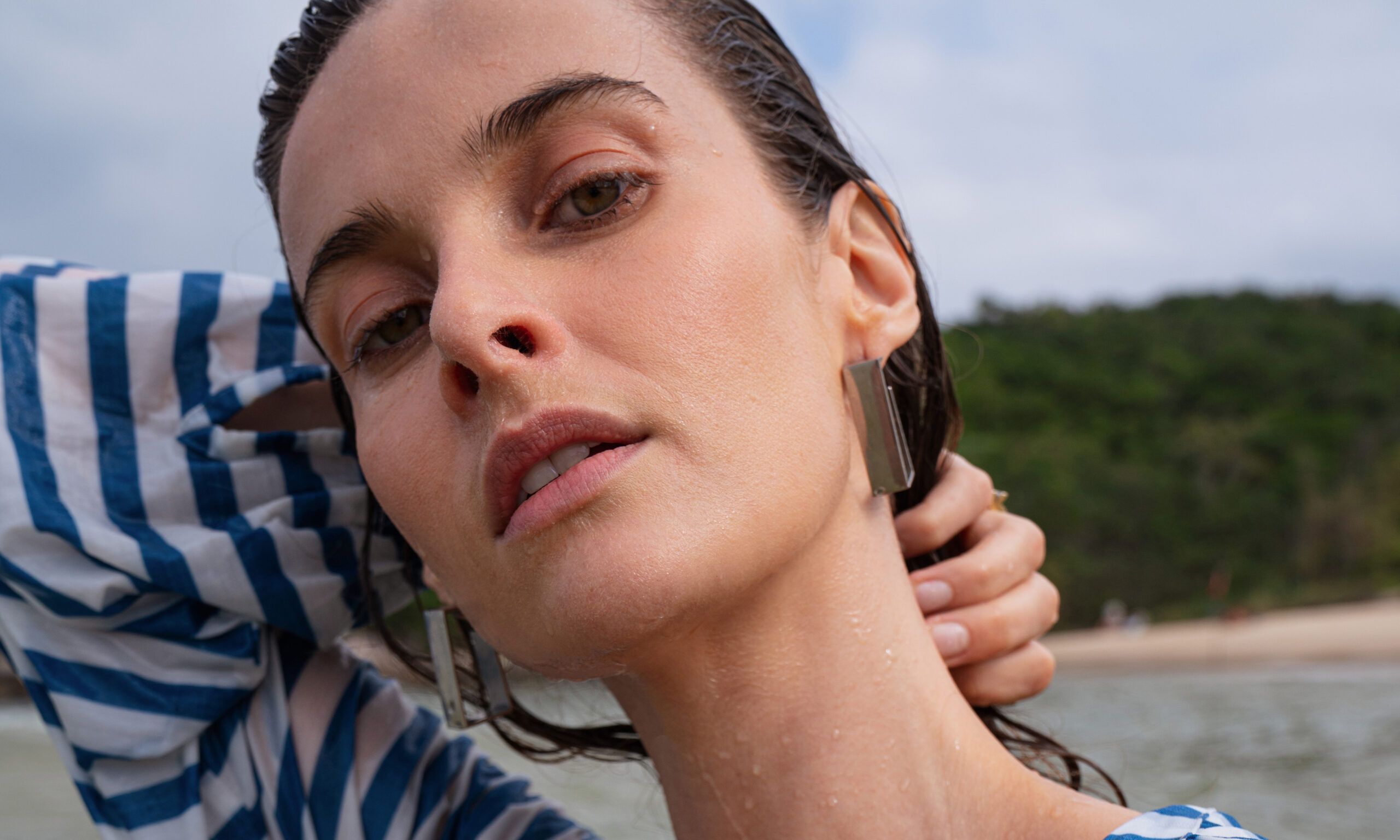 Close up of a young woman on the beach.