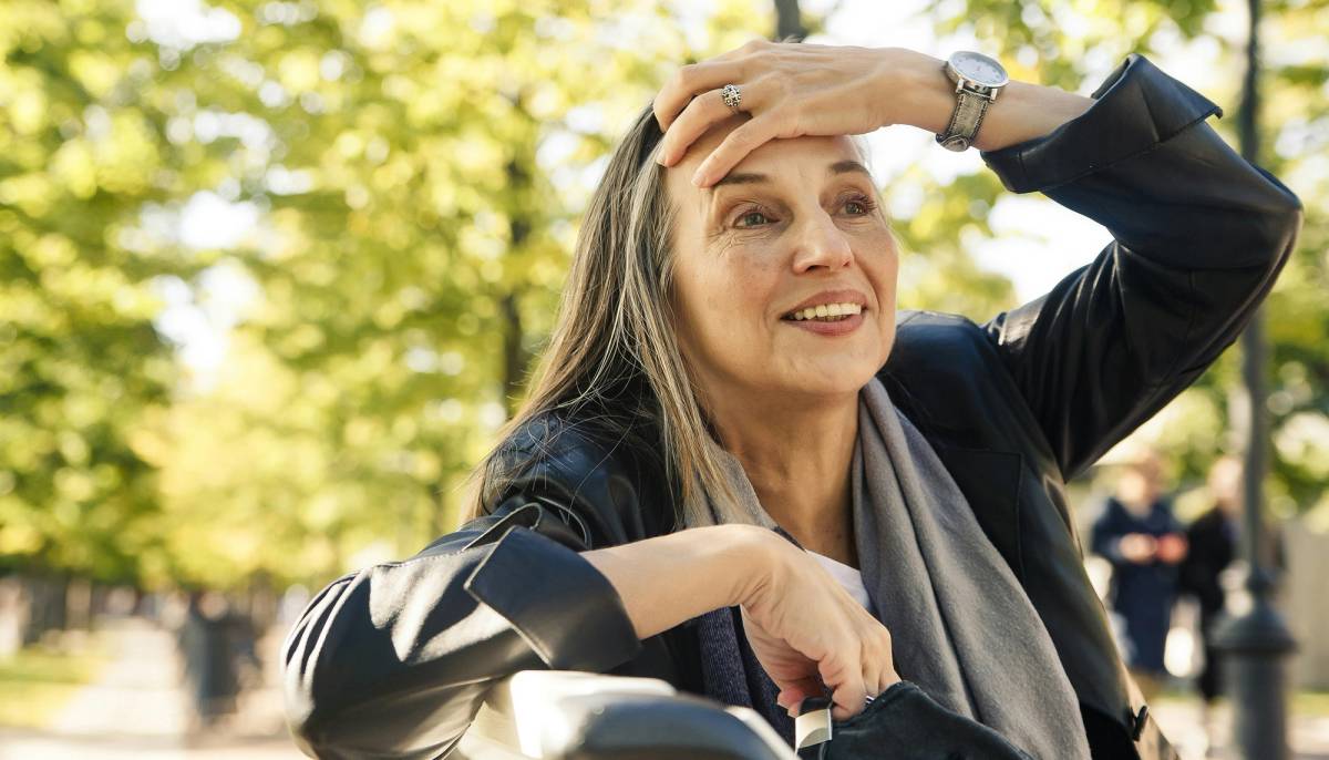 Mature woman sitting outside