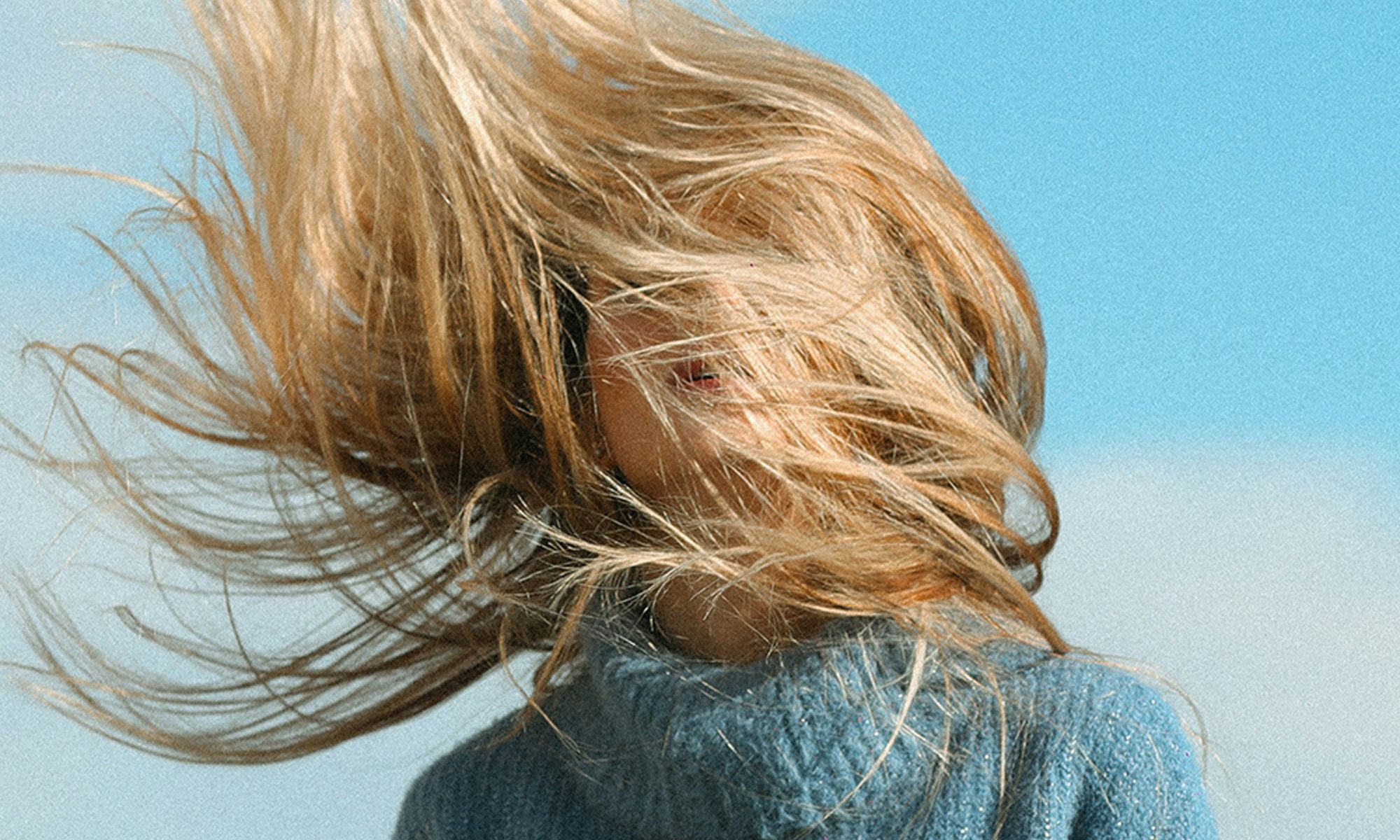 woman with windswept blonde hair