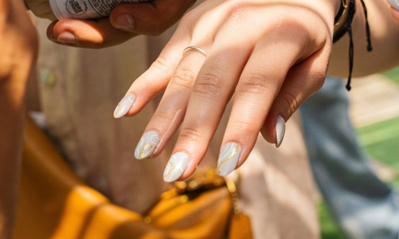 woman showing off manicured finger nails