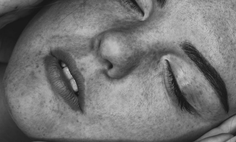 black and white image of woman's face