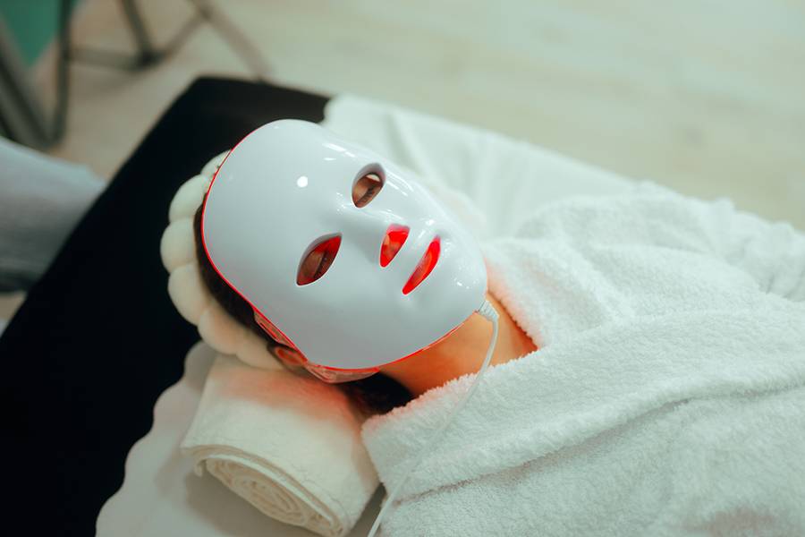 Lady using professional services in a beauty salon for skin care