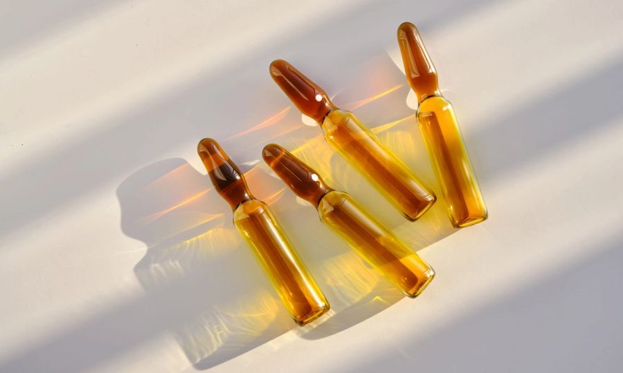 Ampoules against a background of stripes of light.