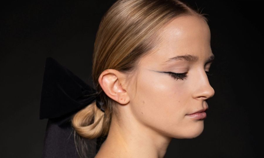 side profile of woman with winged eyeliner