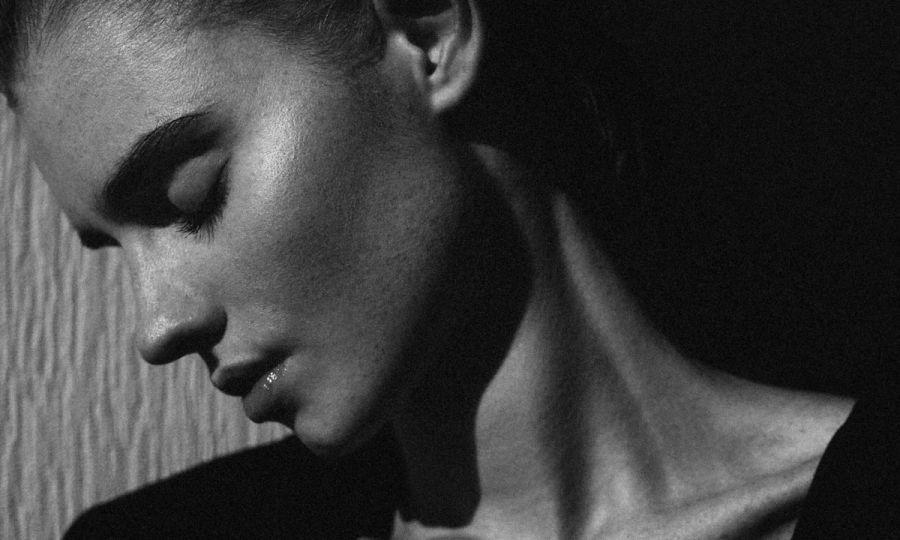 black and white portrait of woman side profile and jawline