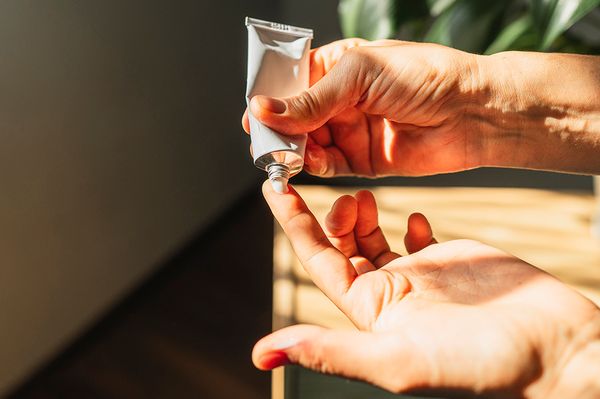 tube-of-skin-care-cream-on-finger