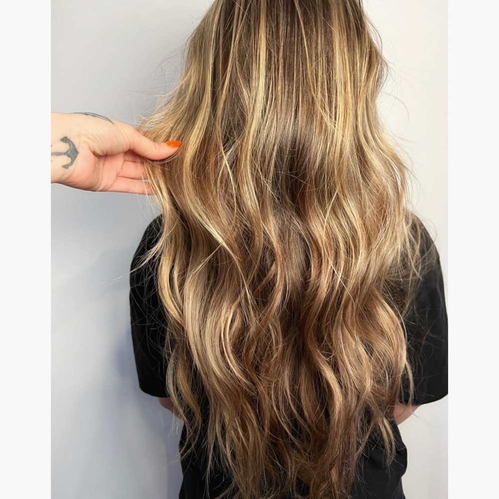 Long wavy hair with blonde moonlight highlights