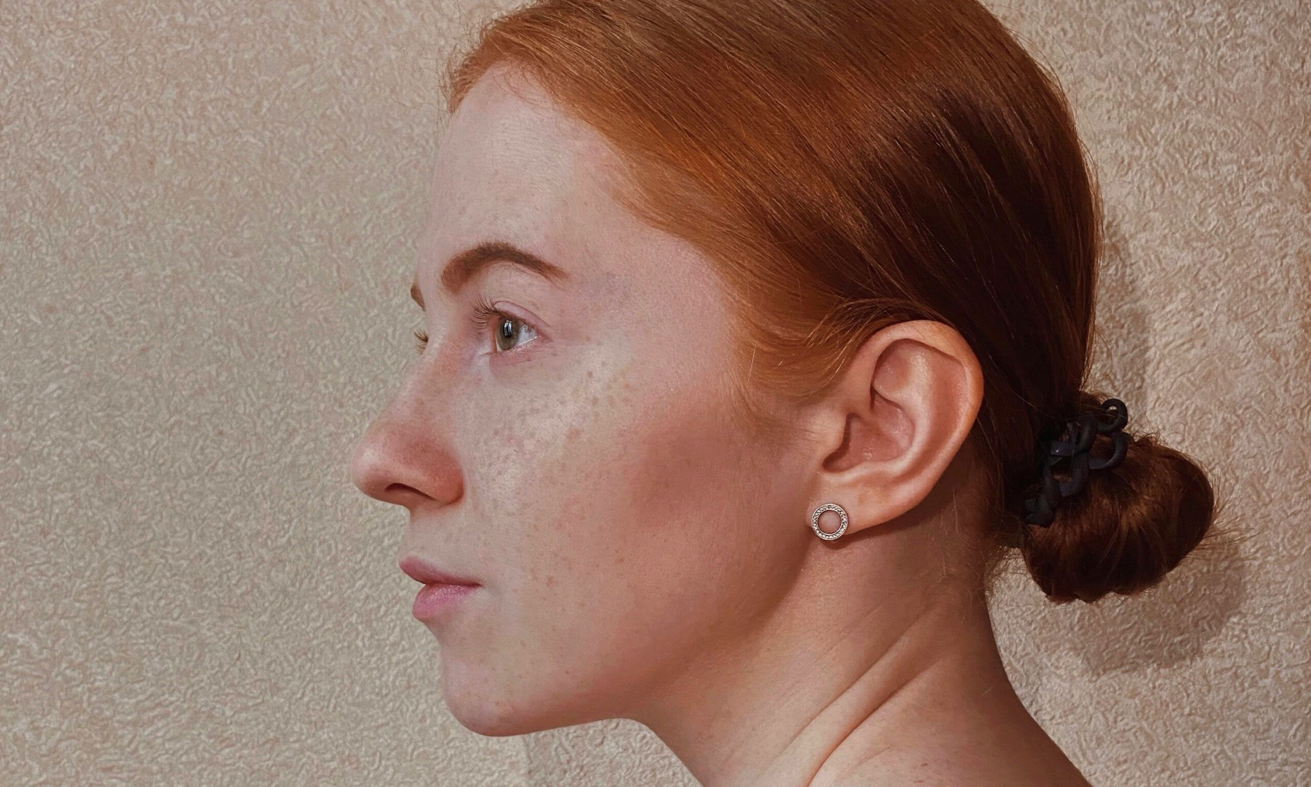 side profile of red-headed woman