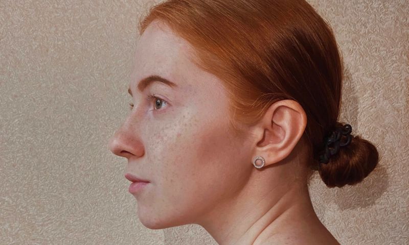side profile of red-headed woman