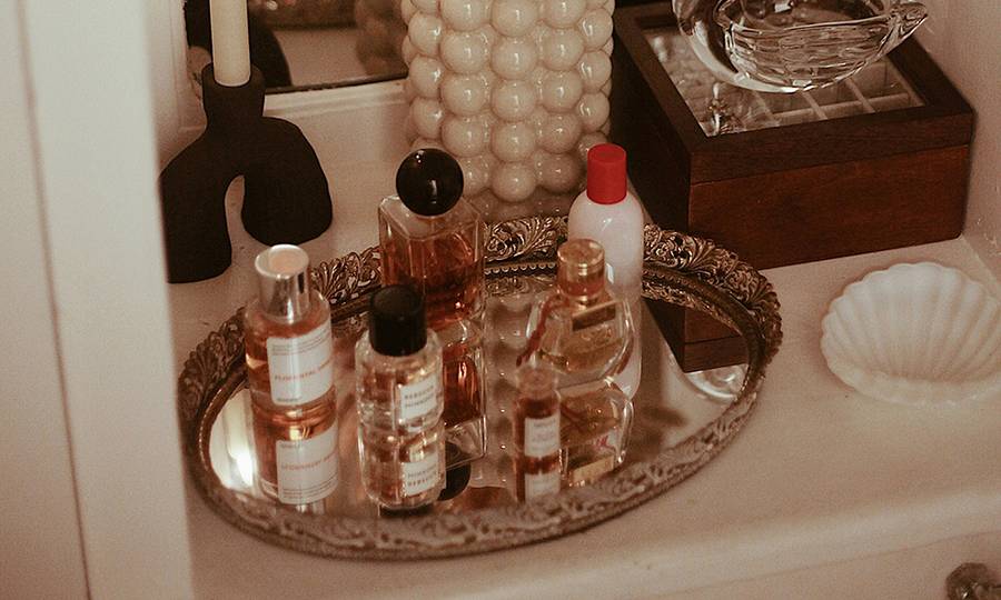 fragrances on platter on vanity
