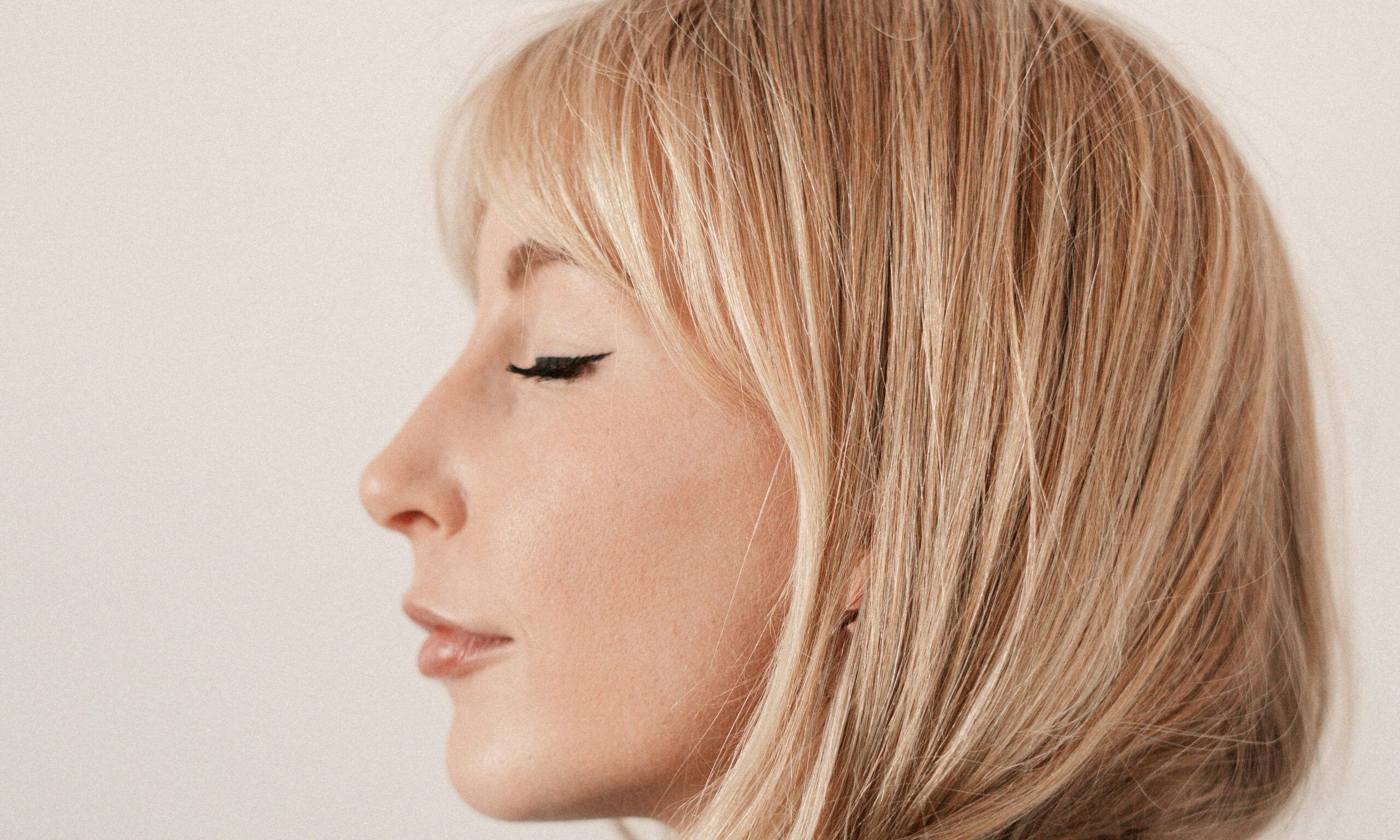 side profile of blonde-haired woman