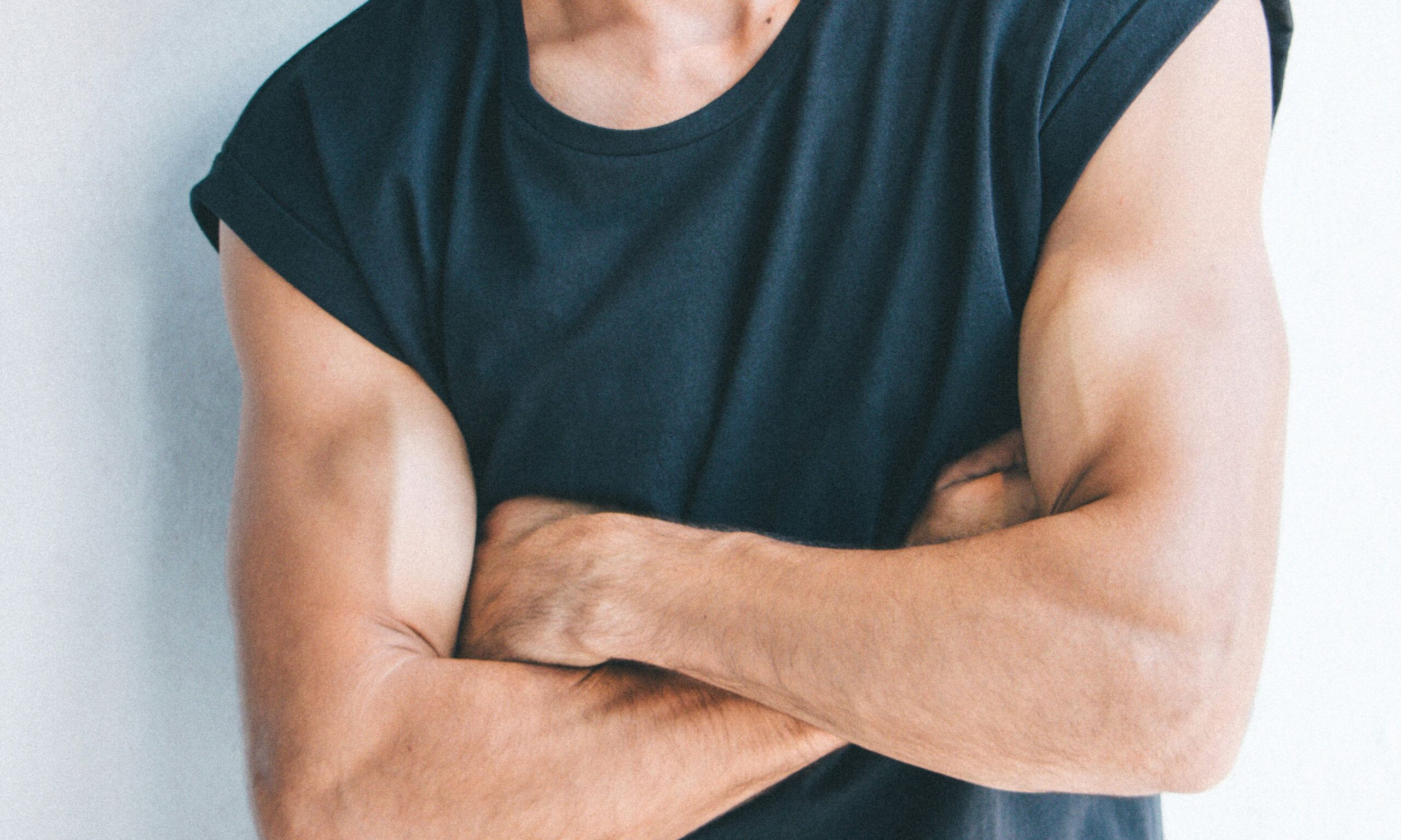 chest view of man crossing his arms