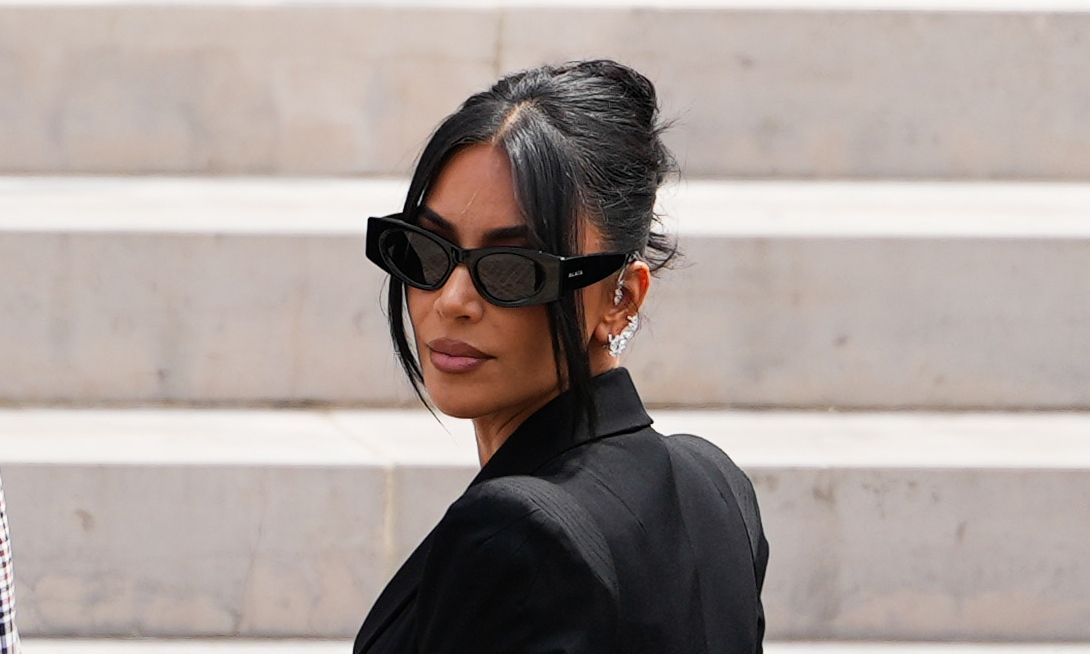 Kim Kardashian arrives at the Palais de Justice, wearing Alaia sunglasses, on May 13, 2025 in Paris, France.