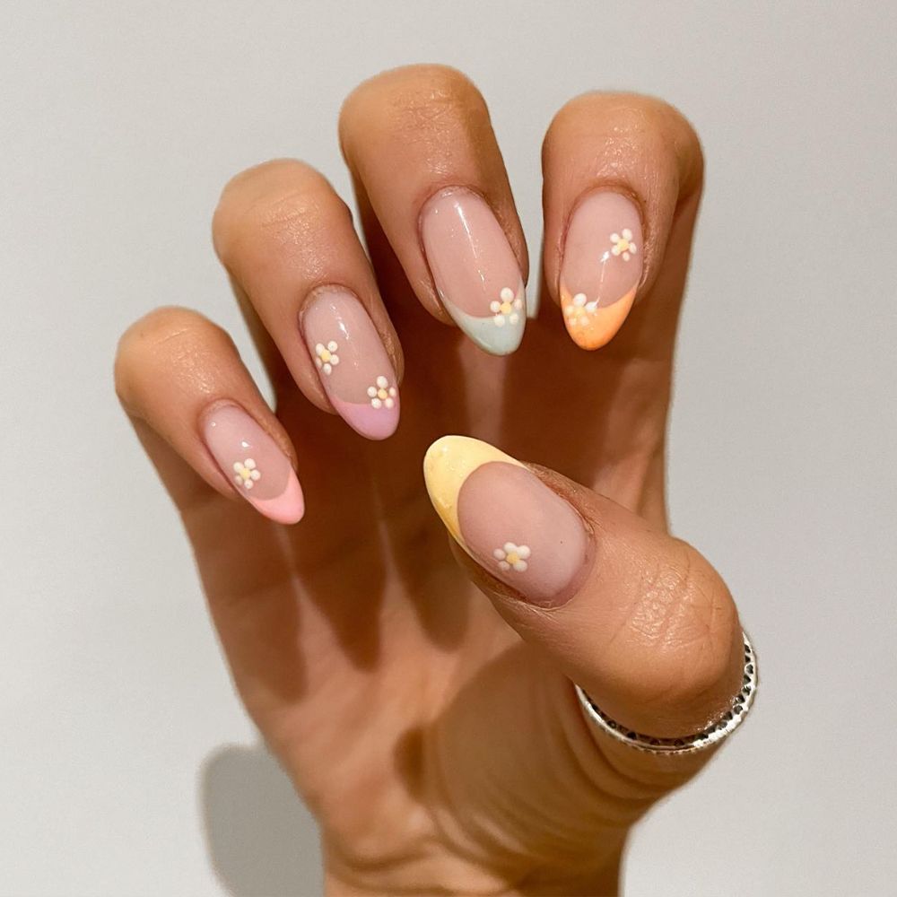 Muted color French manicure with daisy nail art