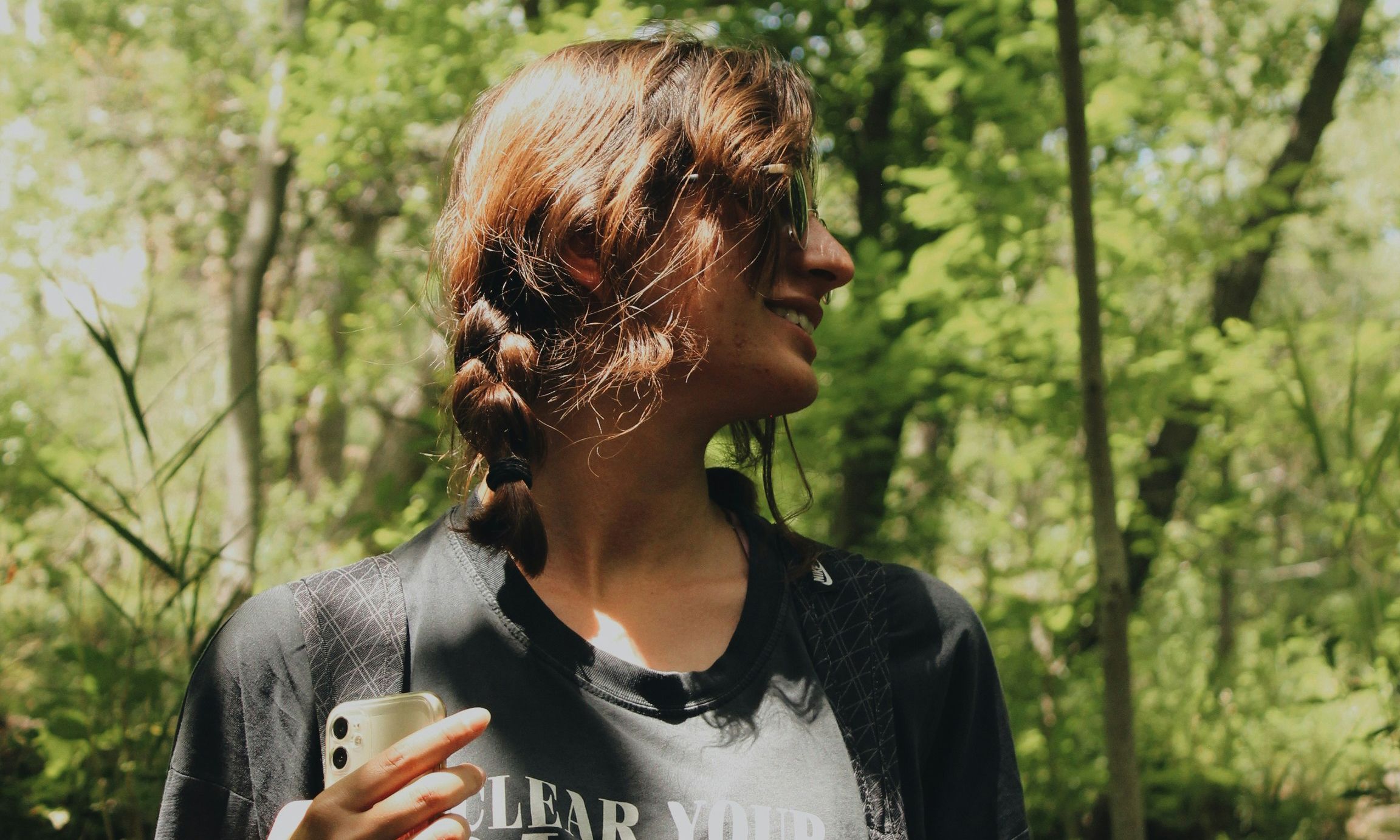 woman walking in lush forest area
