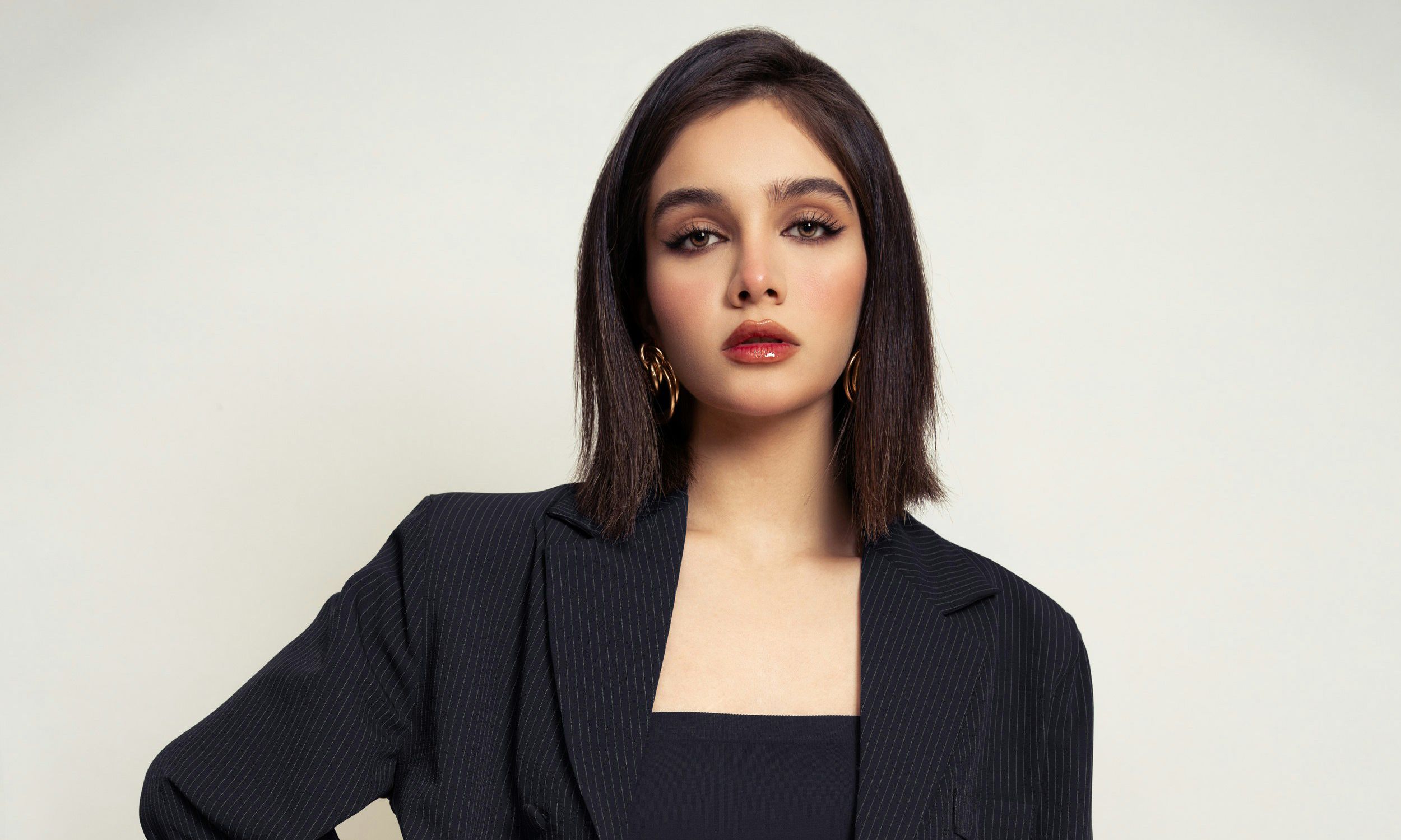 young woman in black blazer