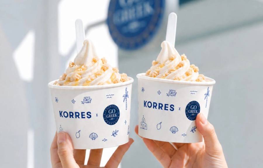 Two Korres x Go Greek frozen yogurt cups topped with crumble and honey