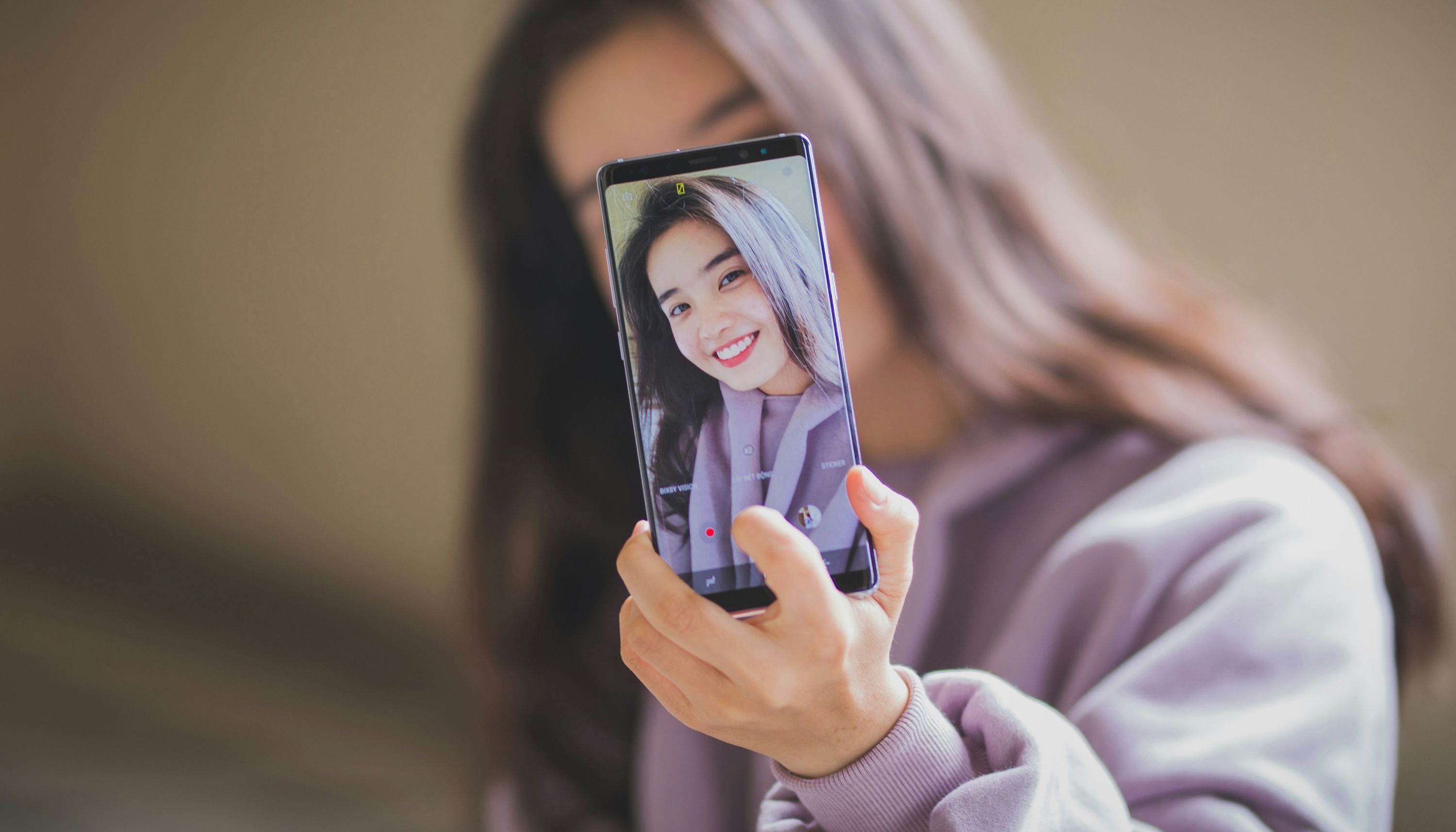 Woman taking a selfie photo