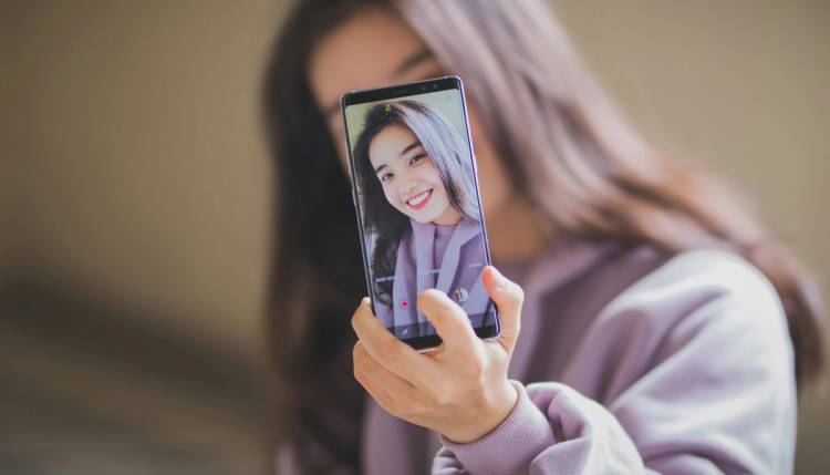 Woman taking a selfie photo