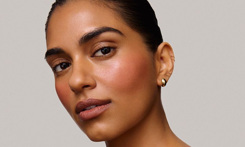 model face wearing merit beauty flush balm blush