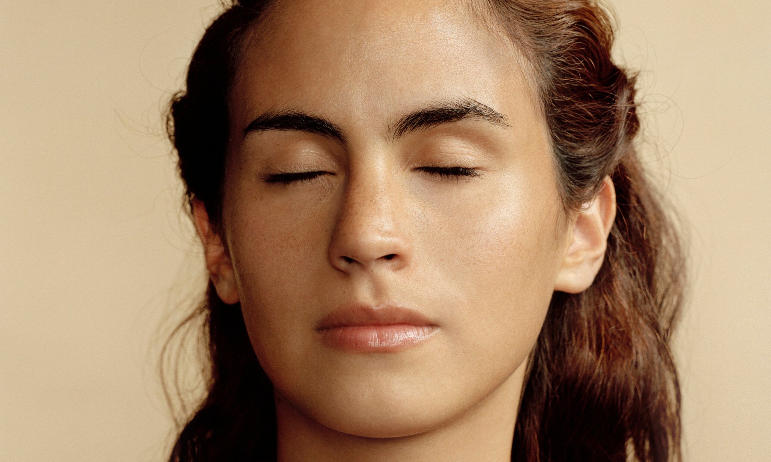 Woman with eyes closed, close-up