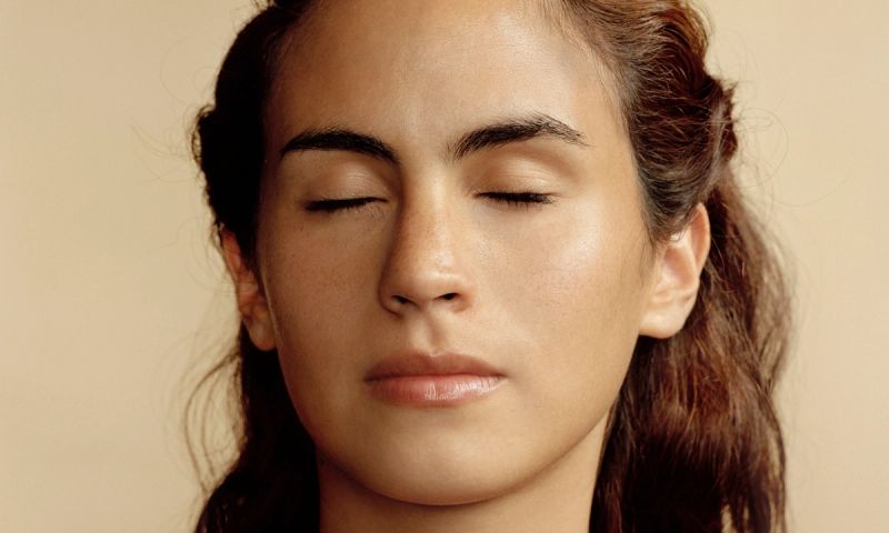 Woman with eyes closed, close-up