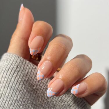 Polka dot French manicure with pastel colors