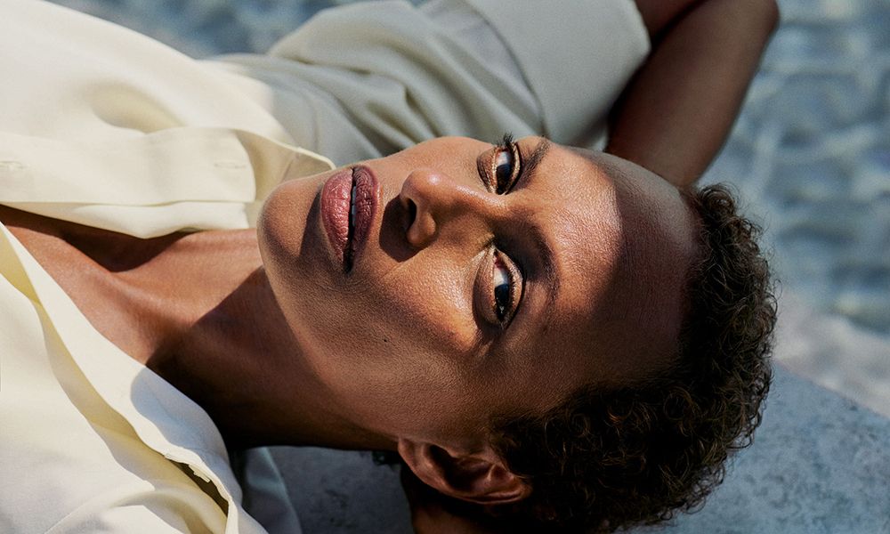 woman laying and looking at camera