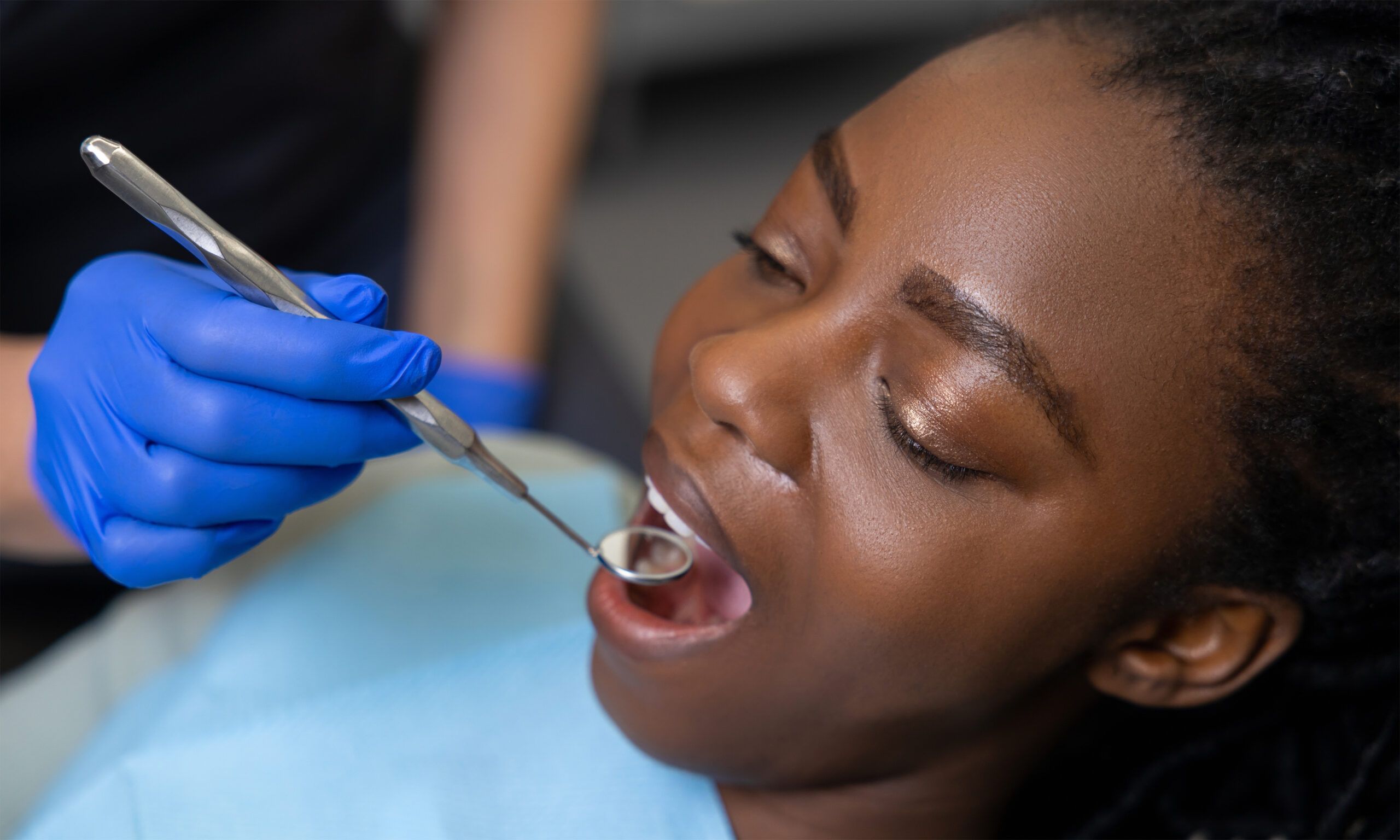 Woman patient receiving dental treatment