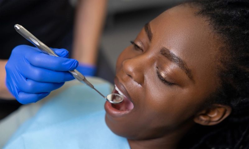 Woman patient receiving dental treatment