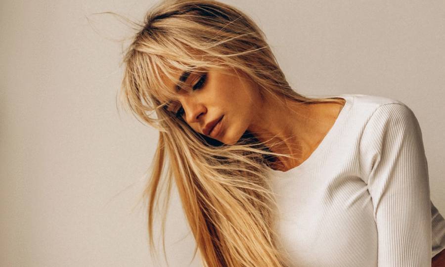 woman with long blonde hair and bangs