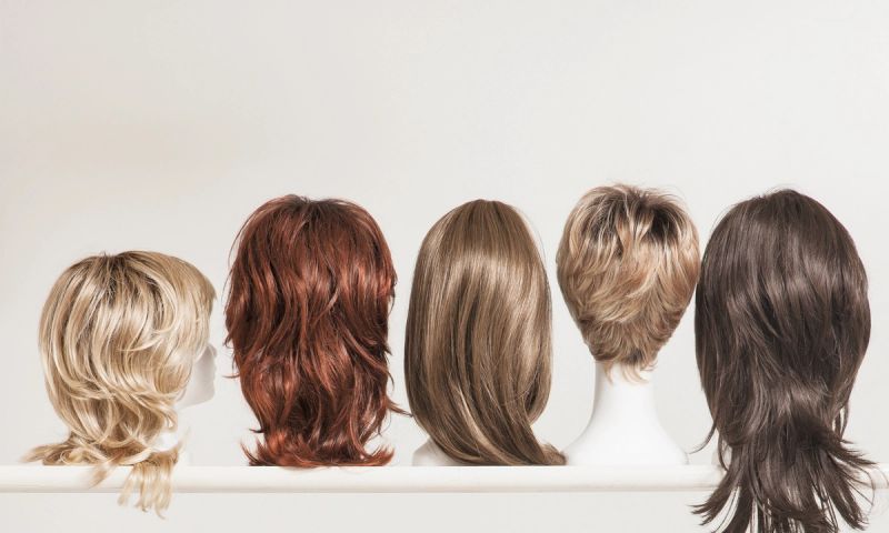 shelf of different hair wigs