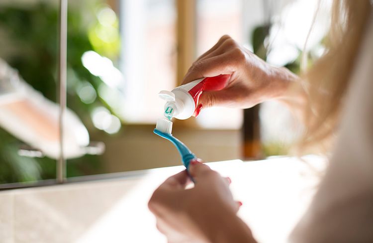 toothpaste on toothbrush