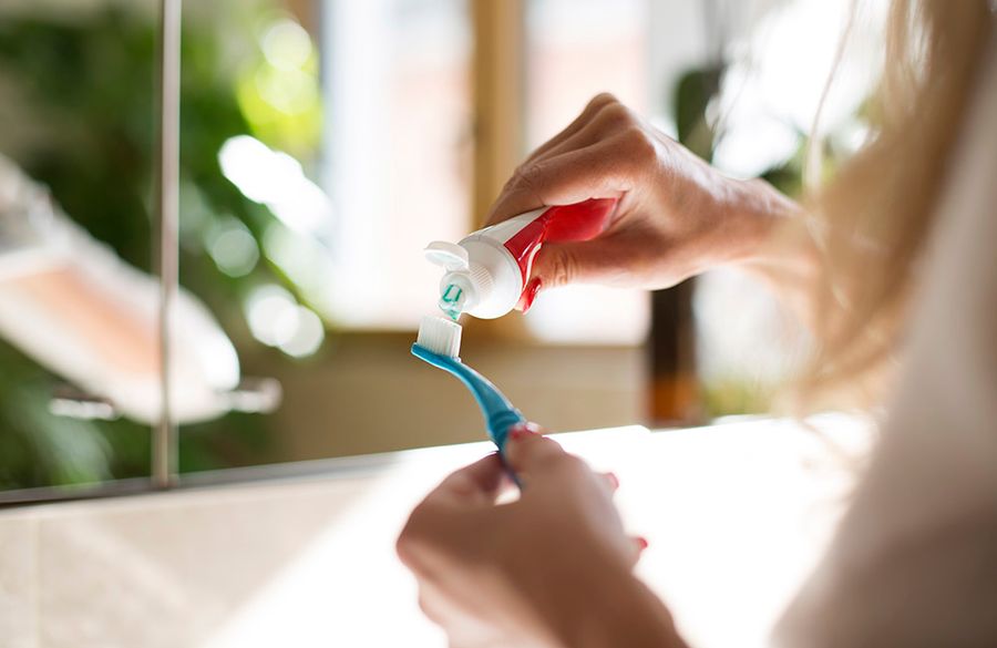 toothpaste on toothbrush