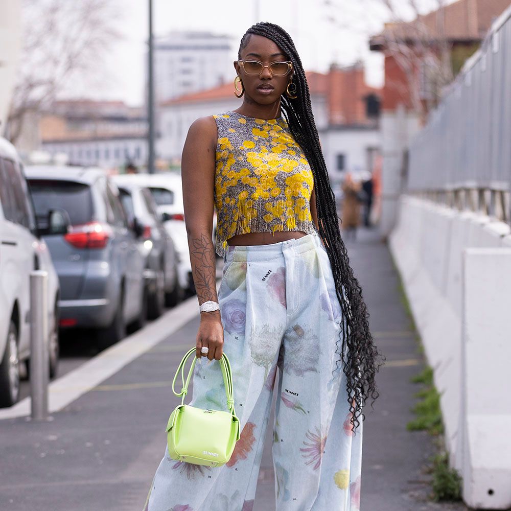 Woman posing with ultra-long braids