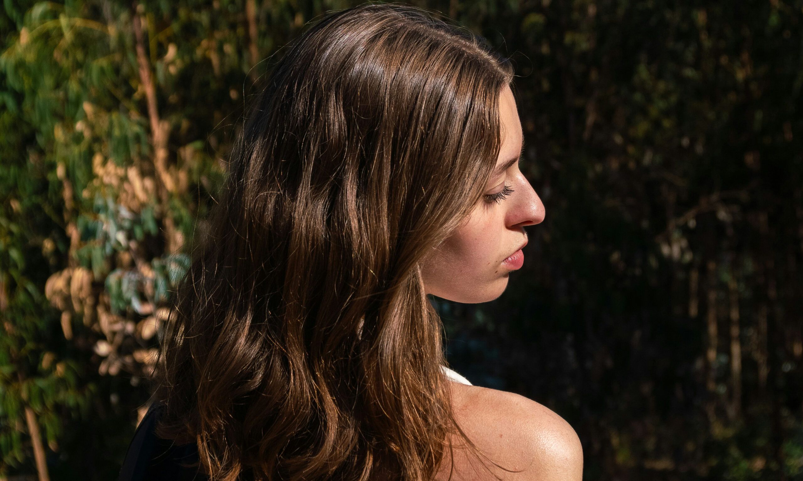 back view of woman looking over her shoulder