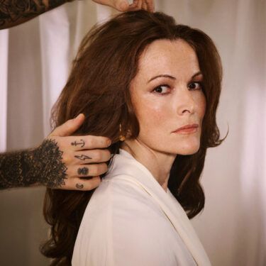 face-framing long layers over 50 hair