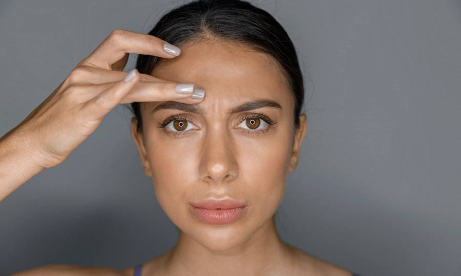 Beautiful healthy smiling caucasian woman is doing beauty procedures at spa and healthcare salon